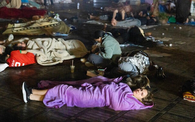 Residents and tourists stay out in a square following an earthquake in Marrakesh on September 9, 2023. (Fadel Senna/AFP)