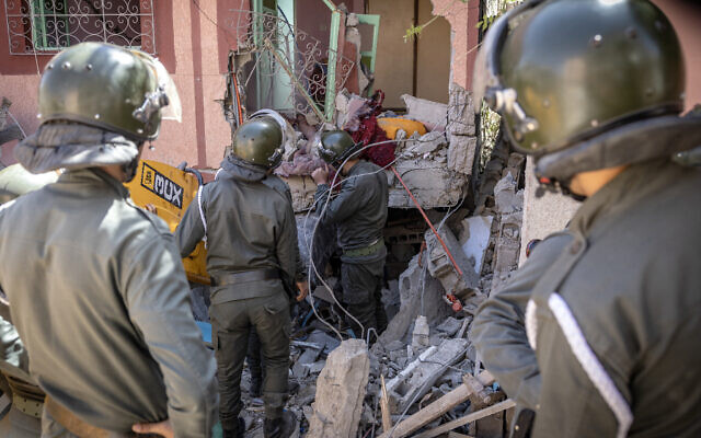Rescuers use a small excavator to search for survivors under the rubble of a collapsed house in Moulay Brahim, Al Haouz province, Morocco, on September 9, 2023, after an earthquake. (Fadel Senna/AFP) Rescuers use a small excavator to search for survivors under the rubble of a collapsed house in Moulay Brahim, Al Haouz province, Morocco, on September 9, 2023, after an earthquake. (Fadel Senna/AFP)