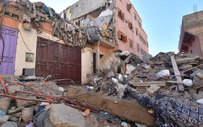 Building rubble blocks a street in Mzouda village in Morocco's Chichaoua province following a devastating earthquake, on September 10, 2023. (Fethi Belaid /AFP)