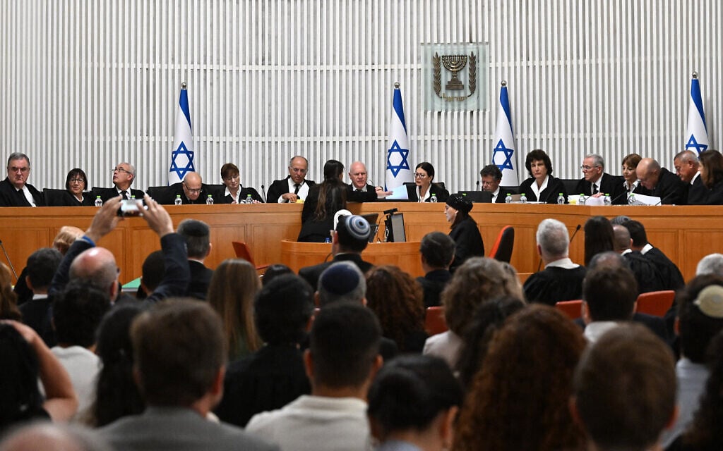 Supreme Court President Esther Hayut and all 14 other judges hear petitions against the 'reasonableness law' at the court in Jerusalem on September 12, 2023. (DEBBIE HILL / POOL / AFP) Supreme Court President Esther Hayut and all 14 other judges hear petitions against the 'reasonableness law' at the court in Jerusalem on September 12, 2023. (DEBBIE HILL / POOL / AFP)