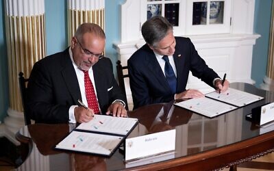 Bahrain's Crown Prince Salman bin Hamad al-Khalifa and US Secretary of State Antony Blinken sign a security integration and prosperity agreement at the US Department of State on September 13, 2023, in Washington. (Brendan Smialowski/AFP)