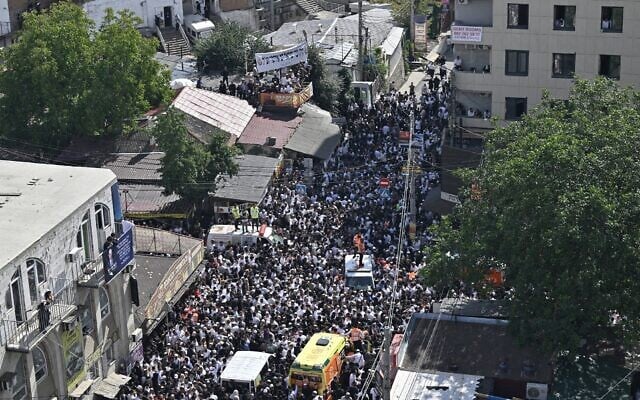This general view shows Hasidic Jewish pilgrims on a street next to the tomb of Rabbi Nachman of Breslov, ahead of Rosh Hashanah, in Uman, central Ukraine, on September 15, 2023, amid the Russian invasion of Ukraine. (Genya Savilov/AFP)