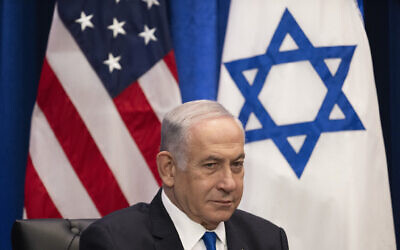 Prime Minister Benjamin Netanyahu listens during a meeting with US President Joe Biden on the sidelines of the 78th United Nations General Assembly in New York City on September 20, 2023. (Photo by Jim WATSON / AFP)