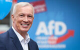 Far-right Alternative for Germany (AfD) candidate Joerg Prophet poses as he campaigns for local elections in Nordhausen, central Germany, on September 21, 2023. (Ronny Hartmann/AFP)