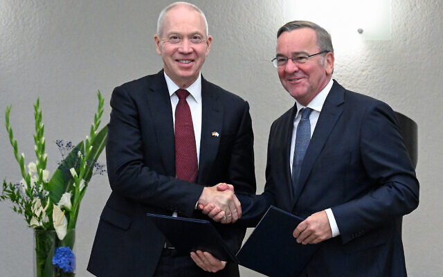 German Defense Minister Boris Pistorius (R) and Israeli Defense Minister Yoav Gallant shake hands after signing a declaration of intent on the Arrow 3 missile defense system, at the German defense ministry in Berlin on September 28, 2023. (Tobias Schwarz/AFP)