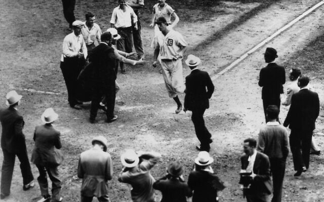 Hank Greenberg scores after hitting a home run to give the Detroit Tigers a 2-1 victory over the Boston Red Sox, September 10, 1934. (UPI/Bettmann Archive/Getty Images via JTA)