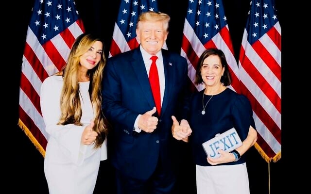 Siggy Flicker, left, poses with former president Donald Trump, center. (Courtesy Siggy Flicker via JTA)