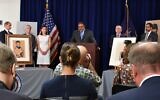 Manhattan District Attorney Alvin Bragg (center) delivers remarks during a ceremony to return stolen artworks to the heirs of Fritz Grünbaum's estate, in New York, Sepember 20, 2023. Timothy Reif, David Frankel, and Sarah Reif, left of Bragg, are pictured from left to right. (Jackie Hajdenberg via JTA)