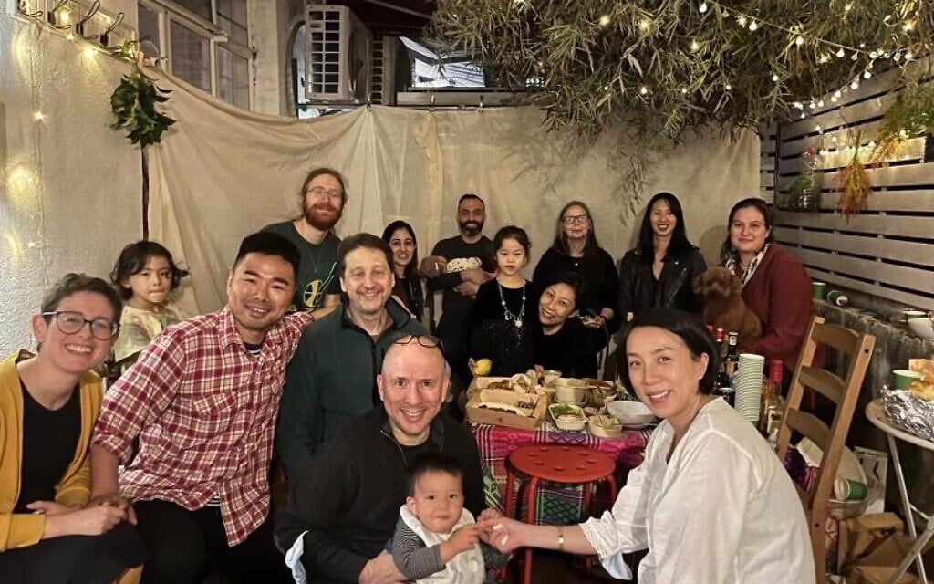 Rebecca Kanthor, far left, celebrating Sukkot with members of Kehilat Shanghai. (Courtesy of Kanthor/via JTA)