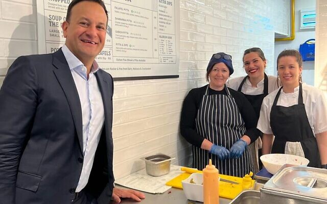 Irish Prime Minister Leo Varadkar, left, with staff of Deli 613 in Dublin, 2023. (Courtesy)