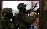 Israeli troops take measurements at the home of a Palestinian terrorist in the West Bank town of Deir Ammar, ahead of a potential demolition, September 1, 2023. (Israel Defense Forces)