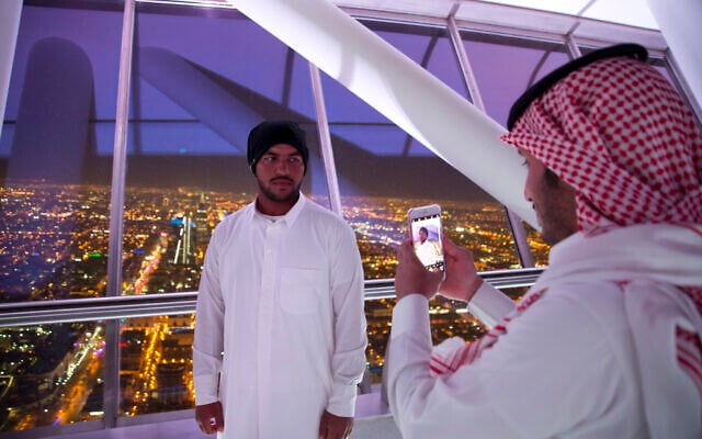 In this March 9, 2018 photo, visitors of Al Mamlaka tower, a 99-story skyscraper, take pictures with city view of Riyadh, Saudi Arabia. (AP Photo/Amr Nabil) In this March 9, 2018 photo, visitors of Al Mamlaka tower, a 99-story skyscraper, take pictures with city view of Riyadh, Saudi Arabia. (AP Photo/Amr Nabil)