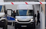 Illustrative: Officers stand by a police van after entering the grounds of the courthouse complex in the southwest coastal city of Paphos, Cyprus, Dec. 5, 2022. (AP Photo/Petros Karadjias)