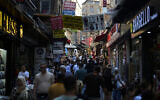 Illustrative: People walk along a street market at Eminonu commercial area in Istanbul, Turkey, August 23, 2023. (AP Photo/Khalil Hamra)