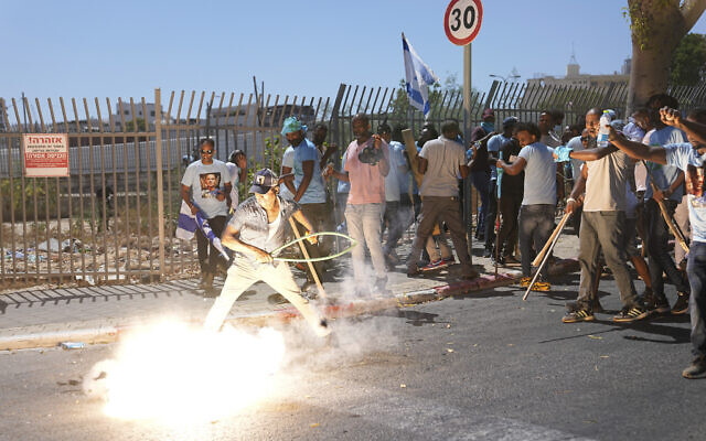 A stun grenade thrown by Israeli police explodes next to Eritrean protesters during a protest against an event organized by the Eritrea Embassy, in Tel Aviv, Israel, September 2, 2023. (AP Photo/Ohad Zwigenberg) A stun grenade thrown by Israeli police explodes next to Eritrean protesters during a protest against an event organized by the Eritrea Embassy, in Tel Aviv, Israel, September 2, 2023. (AP Photo/Ohad Zwigenberg)