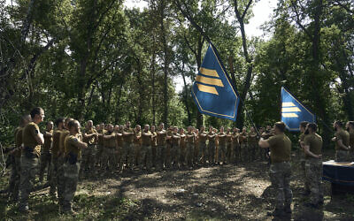 Soldiers of Ukraine's 3rd Separate Assault Brigade shout slogans as they stand in line, near Bakhmut, the site of fierce battles with the Russian forces in the Donetsk region, Ukraine, Sunday, Sept. 3, 2023. (AP/Libkos) Soldiers of Ukraine's 3rd Separate Assault Brigade shout slogans as they stand in line, near Bakhmut, the site of fierce battles with the Russian forces in the Donetsk region, Ukraine, Sunday, Sept. 3, 2023. (AP/Libkos)
