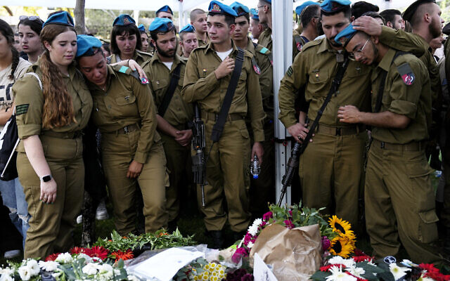 Israeli soldiers mourn during the funeral of Staff Sgt. Maksym Molchanov in Kiryat Shaul military cemetery in Tel Aviv, Israel, September 5, 2023. (AP Photo/Ariel Schalit) Israeli soldiers mourn during the funeral of Staff Sgt. Maksym Molchanov in Kiryat Shaul military cemetery in Tel Aviv, Israel, September 5, 2023. (AP Photo/Ariel Schalit)