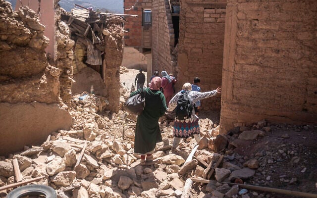 Residents flee their homes after an earthquake in Moulay Brahim village, near the epicenter of the earthquake, outside Marrakech, Morocco, September 9, 2023. (AP Photo/Mosa'ab Elshamy) Residents flee their homes after an earthquake in Moulay Brahim village, near the epicenter of the earthquake, outside Marrakech, Morocco, September 9, 2023. (AP Photo/Mosa'ab Elshamy)
