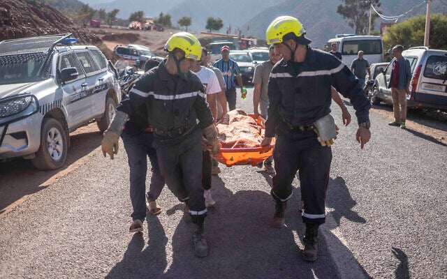 Members of rescue teams carry the body of a victim of an earthquake in Ouargane village, near Marrakech, Morocco, Saturday, Sept. 9, 2023. (AP Photo/Mosa'ab Elshamy) Members of rescue teams carry the body of a victim of an earthquake in Ouargane village, near Marrakech, Morocco, Saturday, Sept. 9, 2023. (AP Photo/Mosa'ab Elshamy)