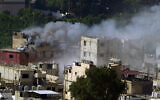 Smoke rises during clashes between members of the Palestinian Fatah group and Islamist groups in the Palestinian refugee camp of Ein el-Hilweh near the southern port city of Sidon, Lebanon, September 10, 2023. (AP Photo/Bilal Hussein)