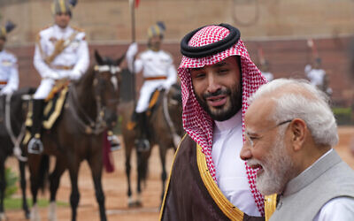 Crown Prince Mohammed bin Salman of Saudi Arabia, left, speaks to Indian Prime Minister Narendra Modi upon his arrival for a ceremonial reception at the Indian presidential palace, in New Delhi, India, Sept. 11, 2023. (AP Photo/Manish Swarup)
