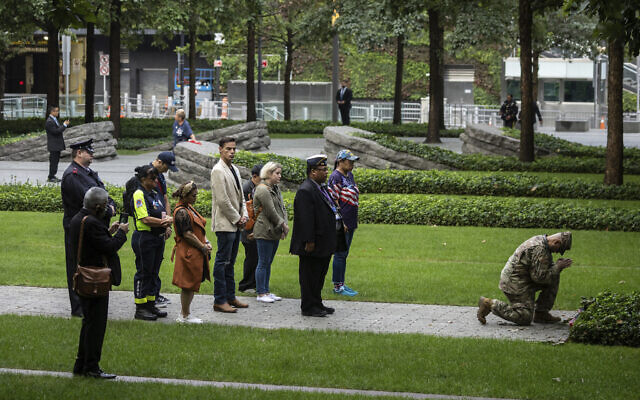 People pray before the commemoration ceremony on the 22nd anniversary of the September 11, 2001, terror attacks on Monday, Sept. 11, 2023, in New York. (AP/Yuki Iwamura)