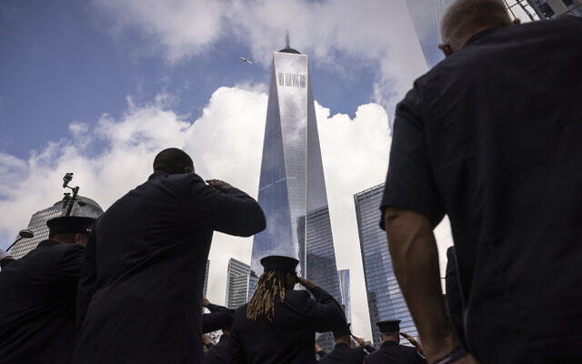 Firefighters salute during a moment of silence outside the commemoration ceremony on the 22nd anniversary of the September 11, 2001, terror attacks on Monday, Sept. 11, 2023, in New York. (AP/Yuki Iwamura)
