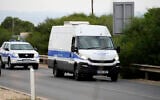 File - The police van carrying the five Israelis who are accused of raping a British woman, arrives at the Famagusta District Courthouse in Paralimni, Cyprus, on September 12, 2023. (AP Photo/Petros Karadjias)
