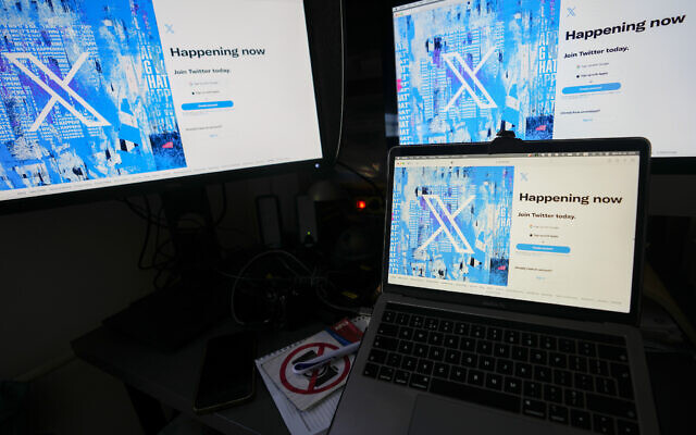 Computer monitors and a laptop display the X, formerly known as Twitter, sign-in page, in Belgrade, Serbia, July 24, 2023. (Darko Vojinovic/AP) Computer monitors and a laptop display the X, formerly known as Twitter, sign-in page, in Belgrade, Serbia, July 24, 2023. (Darko Vojinovic/AP)