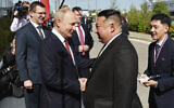 Russian President Vladimir Putin, left, and North Korea's leader Kim Jong Un shake hands during their meeting at the Vostochny cosmodrome outside the city of Tsiolkovsky, about 200 kilometers (125 miles) from the city of Blagoveshchensk in the far eastern Amur region, Russia, on Sept. 13, 2023. (Vladimir Smirnov, Sputnik, Kremlin Pool Photo via AP)