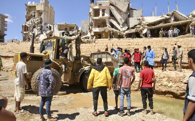People look for survivors in Derna, Libya, Sept.13, 2023. (AP Photo/Yousef Murad) People look for survivors in Derna, Libya, Sept.13, 2023. (AP Photo/Yousef Murad)