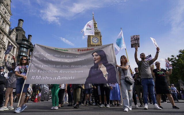 Demonstrators march in Parliament Square as they hold a banner, in London, September 16, 2023, as today marks the anniversary of the death of Mahsa Amini in Iran. (AP Photo/Alberto Pezzali) Demonstrators march in Parliament Square as they hold a banner, in London, September 16, 2023, as today marks the anniversary of the death of Mahsa Amini in Iran. (AP Photo/Alberto Pezzali)
