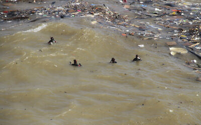 Divers look for flash flood victims in the city of Derna, Libya, September 18, 2023. (AP Photo/Yousef Murad)