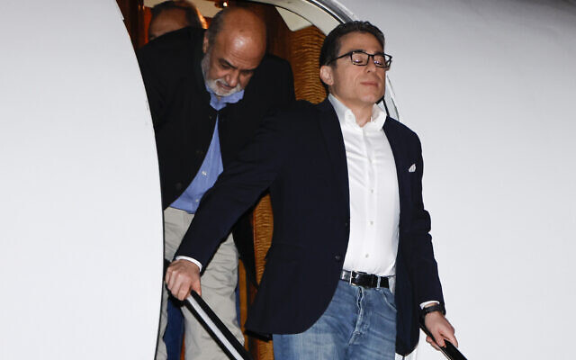 Siamak Namazi pauses on the steps as he and fellow freed Americans Morad Tahbaz and Emad Shargi, as well as two returnees whose names have not yet been released by the US government, who were released in a prisoner swap deal between US and Iran, arrive at Davison Army Airfield, Tuesday, Sept. 19, 2923 at Fort Belvoir, Va. (Jonathan Ernst/Pool via AP)