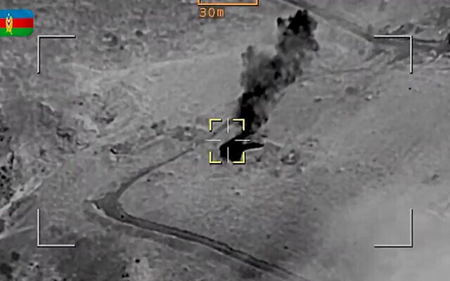 In this photo taken from video released by the Defense Ministry of Azerbaijan on September 20, 2023, smoke rises over an area which Azerbaijan says hosts Armenian forces' positions in the territory of Nagorno-Karabakh. (Defense Ministry of Azerbaijan via AP) In this photo taken from video released by the Defense Ministry of Azerbaijan on September 20, 2023, smoke rises over an area which Azerbaijan says hosts Armenian forces' positions in the territory of Nagorno-Karabakh. (Defense Ministry of Azerbaijan via AP)