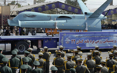 An Iranian Kaman-22 drone is carried on a truck during an annual military parade marking the Iran-Iraq War, in front of the shrine of the late revolutionary founder Ayatollah Khomeini, just outside Tehran, Iran, September 22, 2023. (AP Photo/Vahid Salemi)
