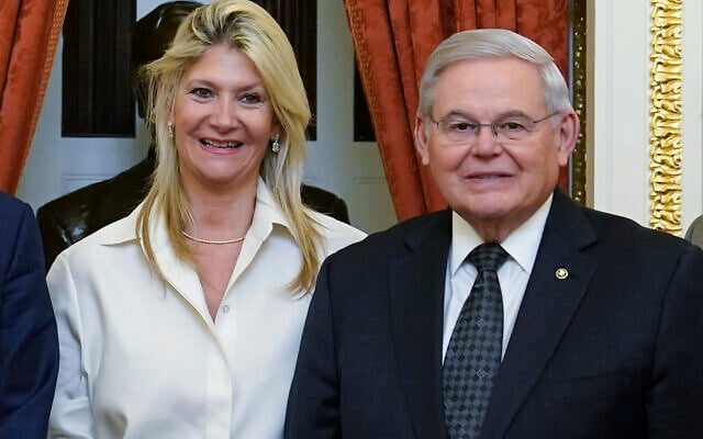 US Senate Foreign Relations Committee Chairman, Sen. Bob Menendez, D-N.J., right, and his wife Nadine Arslanian, pose for a photo on Capitol Hill in Washington, Dec. 20, 2022. (AP Photo/Susan Walsh, File)