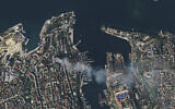In this satellite photo provided by Planet Labs, smoke billows from a headquarters building for the Russian Black Sea fleet in Sevastopol, Crimea on Friday, Sept. 22, 2023, after it was struck in a missile attack launched by the Ukrainian military. (Planet Labs via AP)