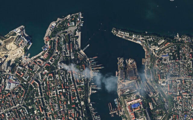 In this satellite photo provided by Planet Labs, smoke billows from a headquarters building for the Russian Black Sea fleet in Sevastopol, Crimea on Friday, Sept. 22, 2023, after it was struck in a missile attack launched by the Ukrainian military. (Planet Labs via AP) In this satellite photo provided by Planet Labs, smoke billows from a headquarters building for the Russian Black Sea fleet in Sevastopol, Crimea on Friday, Sept. 22, 2023, after it was struck in a missile attack launched by the Ukrainian military. (Planet Labs via AP)