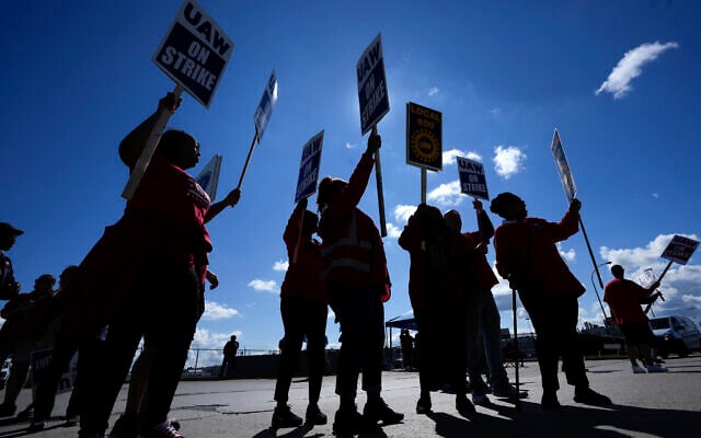 United Auto Workers members walk the picket line at the Ford Michigan Assembly Plant in Wayne, Mich., Monday, September 18, 2023. (AP Photo/Paul Sancya, File) United Auto Workers members walk the picket line at the Ford Michigan Assembly Plant in Wayne, Mich., Monday, September 18, 2023. (AP Photo/Paul Sancya, File)