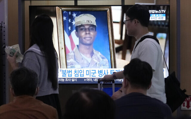A TV screen shows a file image of American soldier Travis King during a news program at the Seoul Railway Station in Seoul, South Korea, Sept. 27, 2023. (AP Photo/Ahn Young-joon)