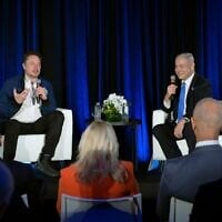In this handout photo, Prime Minister Benjamin Netanyahu (right) speaks with Elon Musk during a live discussion on the social media platform X, at the Tesla factory in Fremont, California, September 18, 2023. (Avi Ohayon/ GPO)