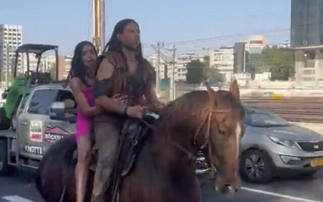 Screen capture from video of Michal Weizman, left, and Roy Oz, riding a horse along the Ayalon Highway in Tel Aviv, September 6, 2023. (X. Used in accordance with Clause 27a of the Copyright Law) Screen capture from video of Michal Weizman, left, and Roy Oz, riding a horse along the Ayalon Highway in Tel Aviv, September 6, 2023. (X. Used in accordance with Clause 27a of the Copyright Law)