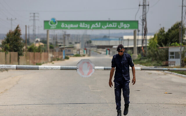 A Palestinian guard at the Erez crossing between Israel and the northern Gaza Strip in Beit Hanun, on August 4, 2022. (Attia Muhammed/Flash90) A Palestinian guard at the Erez crossing between Israel and the northern Gaza Strip in Beit Hanun, on August 4, 2022. (Attia Muhammed/Flash90)