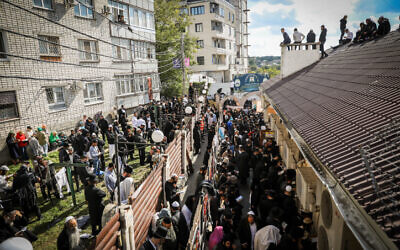 File: Jewish men in the street near the tomb of Rabbi Nachman of Breslov in Uman, on eve of the Jewish holiday of Rosh Hashanah, September 25, 2022 (Flash90)