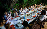 Illustrative: An Israeli family celebrates together on the eve of Rosh Hashanah, the Jewish New Year, on September 25, 2022, in Rananna. (Nati Shohat/Flash90)