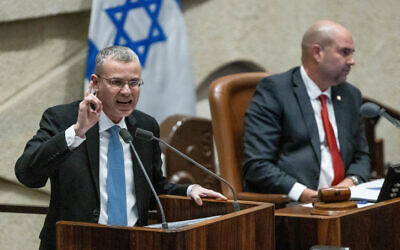 Justice Minister Yariv Levin speaking from the Knesset plenum podium, February 20, 2023. (Yonatan Sindel/Flash90)