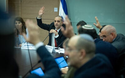 Likud MK Ofir Katz votes in a committee meeting in the Knesset, March 21, 2023. (Yonatan Sindel/Flash90)