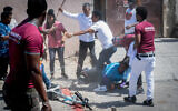 Eritrean migrants who oppose and support that country's regime clash in south Tel Aviv, September 2, 2023 (Omer Fichman/Flash90)