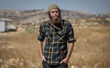 Elisha Yered at the illegal West Bank settlement outpost of Ramat Migron, on September 8, 2023. (Chaim Goldberg/Flash90)